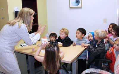 Teacher with group of young students