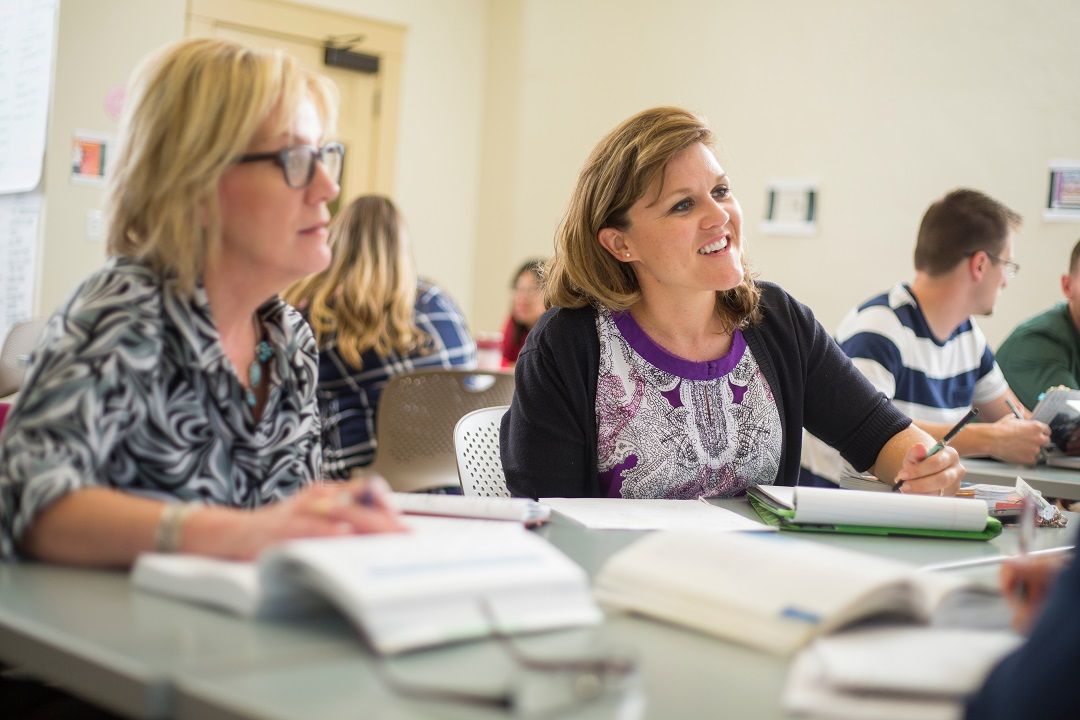 Two women actively listening